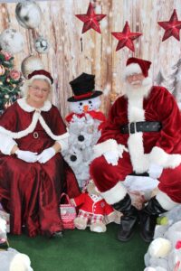 Santa and Mrs Claus at the Oldsmar Cares Spread the Love Kids' Christmas event